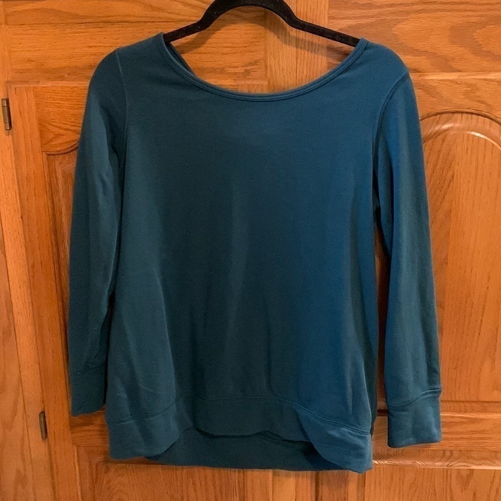 Turquoise crewneck style sweatshirt